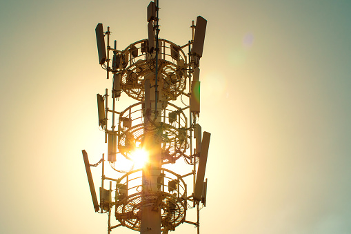 5G Telecommunication tower antenna with sunset