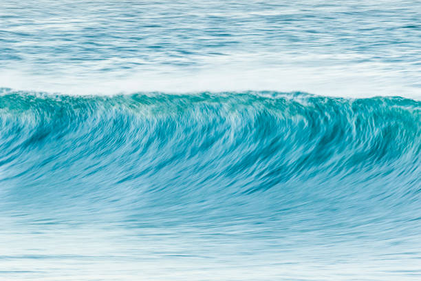 istock A blurred motion photo of a large breaking wave at the beach 1253793782