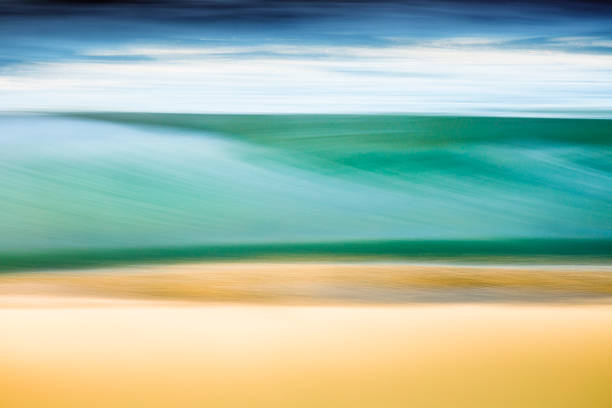 istock A blurred motion photo of a breaking wave at the beach 1253794391