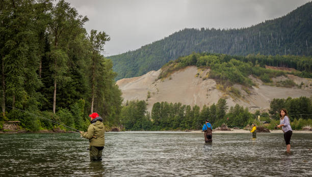 Kitimat,  British Columbia, Canada - July 27th, 2015: Combat fishing for salmon on the Kitimat River, on a summer morning in British Columbia, Canada stock photo