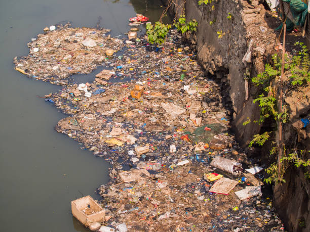 istock Dirty river in Dharavi slums. Mumbai. India 1253795593