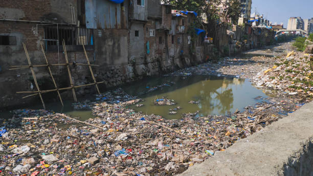 istock Dirty river in Dharavi slums. Mumbai. India 1253795678