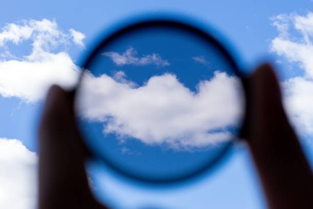 istock man holding a photo polarizer filter. photo accessory increases image contrast and removes glare from the sun 1253798597