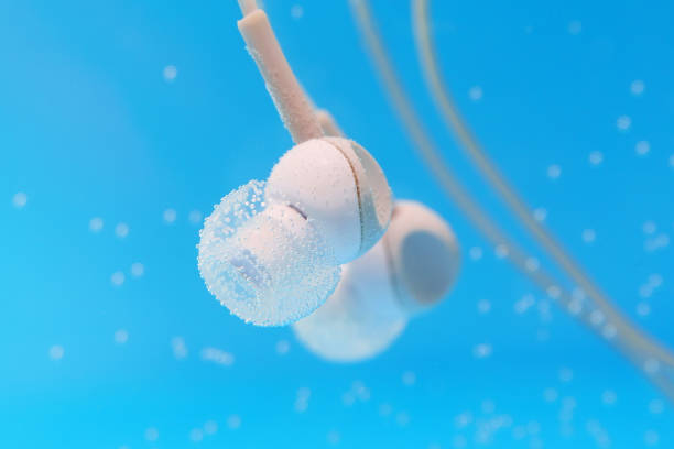 istock Underwater headphones Close up. Underwater, selective focus. music concept 1253799452