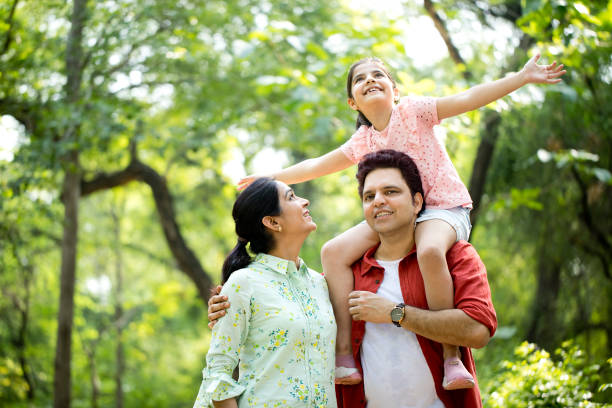 istock Happy family at park 1253801718
