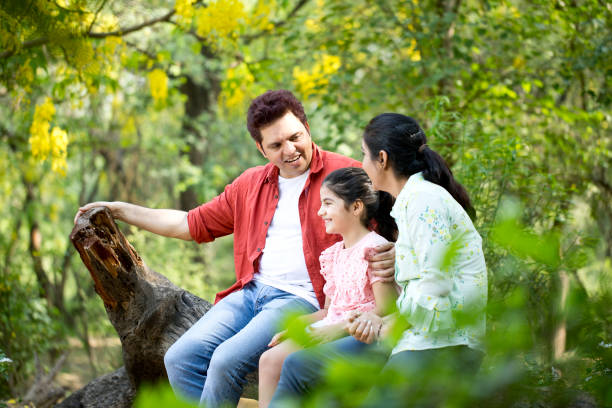 istock Happy family at park 1253801772