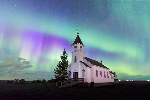 The Aurora Borealis over the historic Zion Lutheran Church south of Kyle, Saskatchewan, Canada