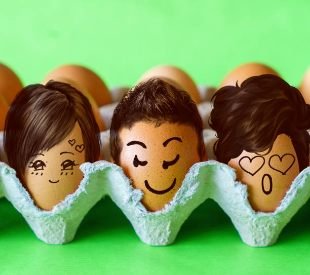 istock Faces on the eggs, One man with two men. Threesome or love triangle 1253803308