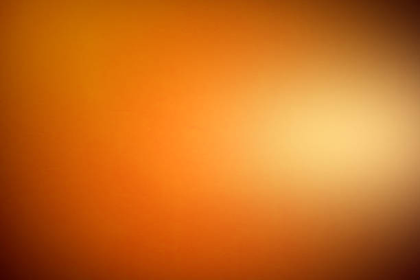 istock Orange bright painted concrete texture Abstract Grunge Decorative Stucco wall background for the designer, Gold background yellow color light corner spotlight faint orange vintage background. 1253804013