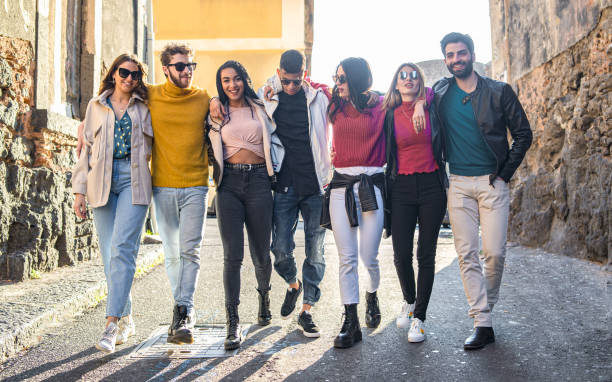 istock Group of multiracial people embracing together. 1253806437