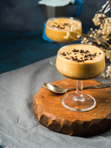 istock Frappe coffee in dessert glasses on brown backdrop 1253808291