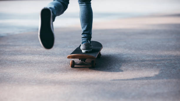 istock Skateboarder legs skateboarding at outdoors 1253808607