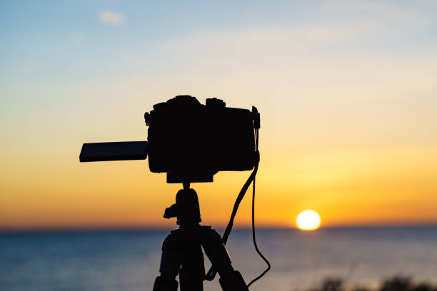 istock Camera take photo from sunrise over sea 1253809533