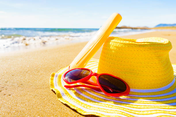 istock Sun protection gear on sand beach 1253810443
