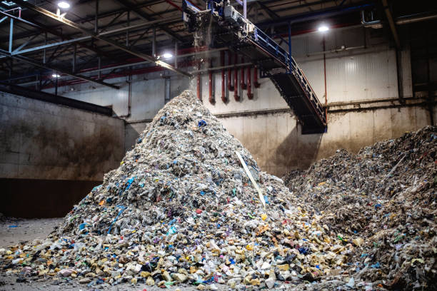 istock Piles of Separated Recyclables Inside Waste Facility 1253813468