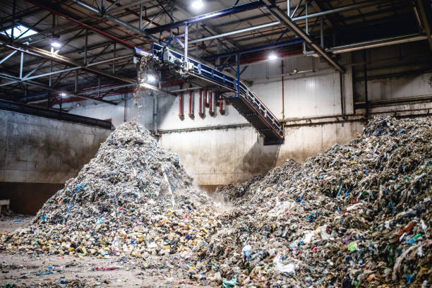 istock Piles of Separated Recyclables Inside Waste Facility 1253813509