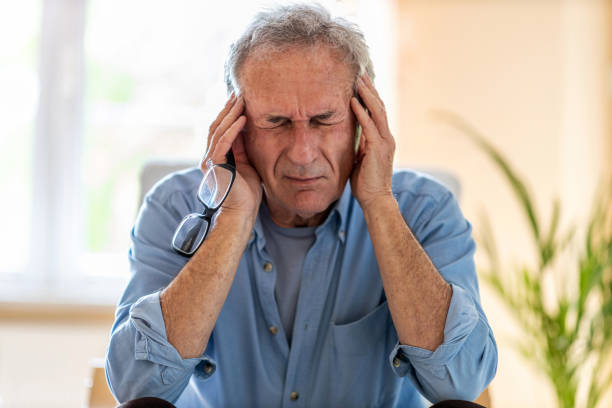 istock Senior man suffering from a headache 1253815310