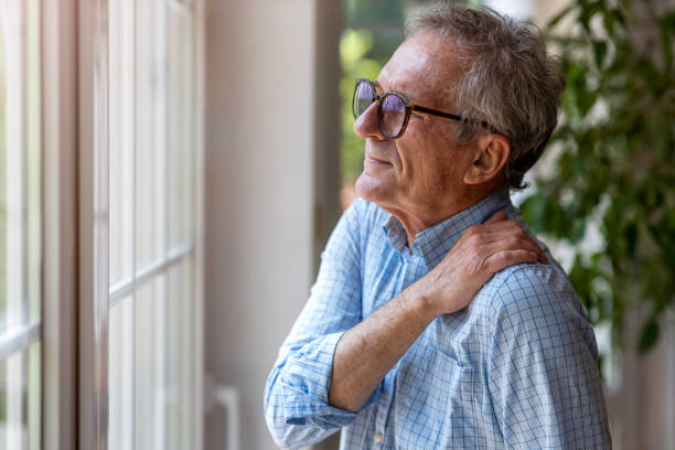 istock Senior man suffering from neck pain 1253815412