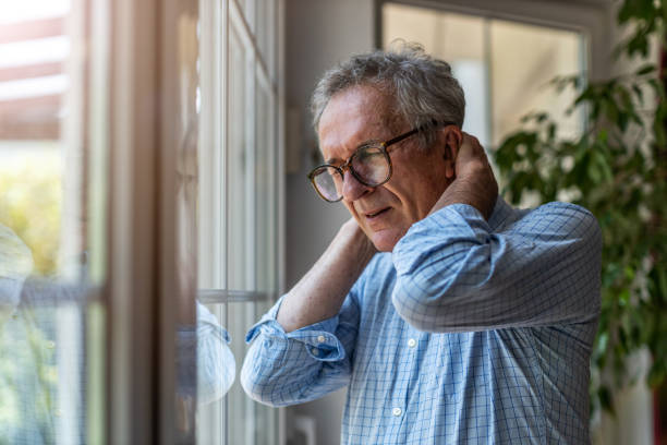 istock Senior man suffering from neck pain 1253815474