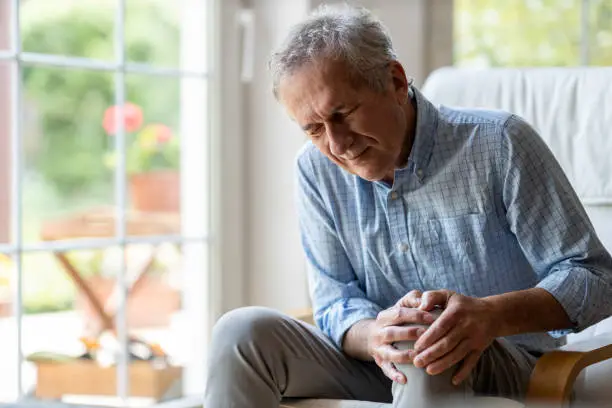 Photo of Senior man with knee pain