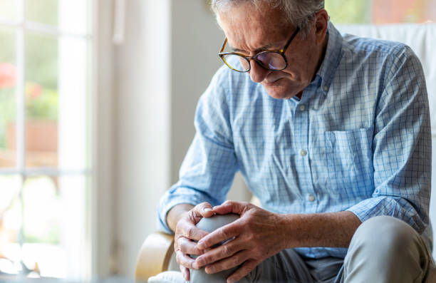 istock Senior man with knee pain 1253815507