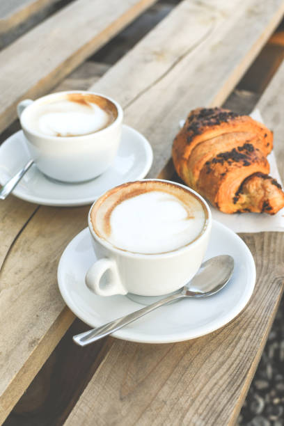 istock Two cups of coffee cappuccino 1253815582