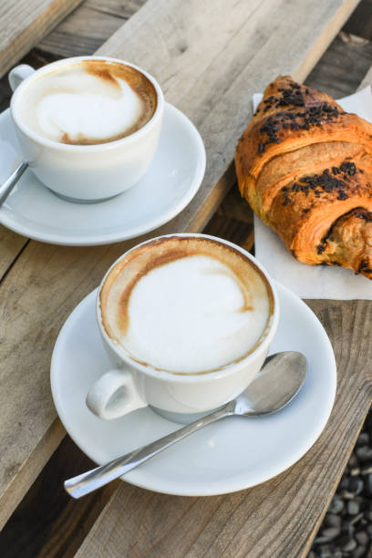istock Two cups of coffee cappuccino 1253816137