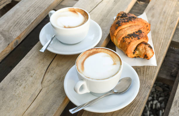 istock Two cups of coffee cappuccino 1253816674