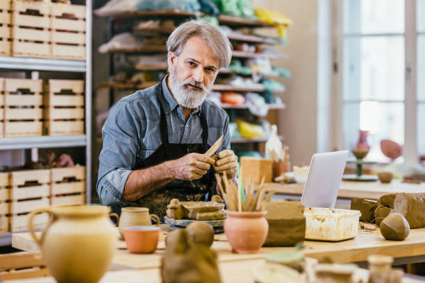 istock Portrait of a craftsperson in a art studio 1253817484