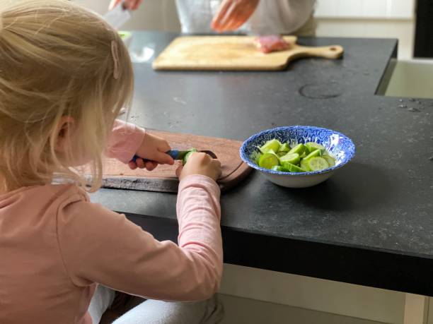 istock Child helping grandmother 1253819826