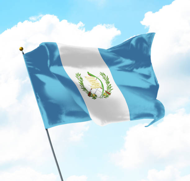 Flag of Guatemala Flag of Guatemala Raised Up in The Sky puerto quetzal guatemala stock pictures, royalty-free photos & images