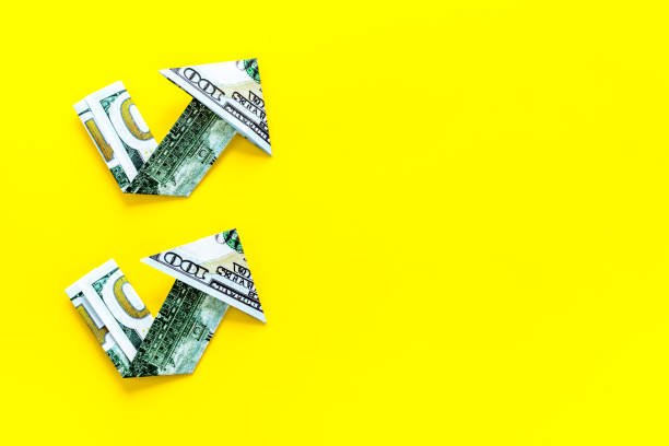 istock Dollar chart on yellow background. Currency trading concept 1253820978