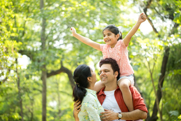istock Happy family at park 1253822435