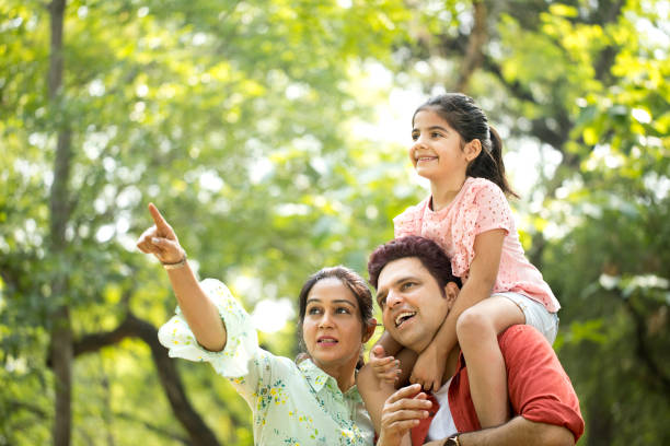 istock Happy family at park 1253822475