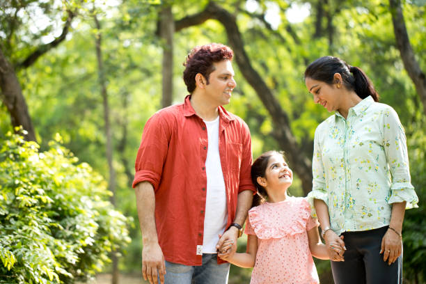 istock Happy family at park 1253822523