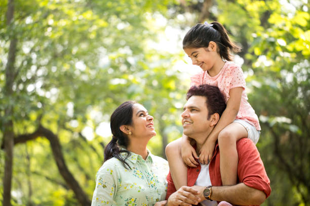 istock Happy family at park 1253822571