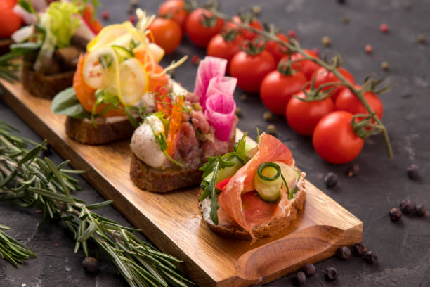istock Assorted bruschetta with meat, cheese, micro green cooked by a catering company 1253823294