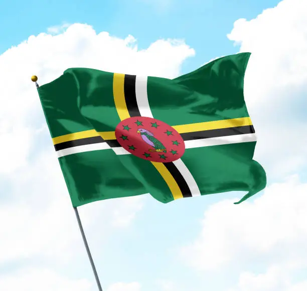 Flag of Dominica Raised Up in The Sky