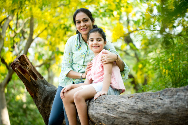 istock Mother and daughter spending leisure time at park 1253823654