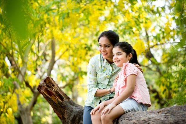 istock Mother and daughter spending leisure time at park 1253823692