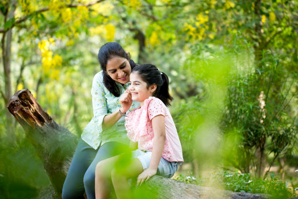 istock Mother and daughter spending leisure time at park 1253823752