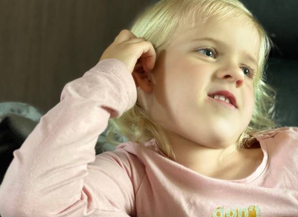 istock Girl watching tv 1253824669