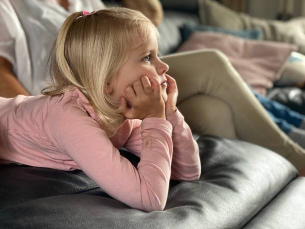 istock Girl watching tv 1253824680