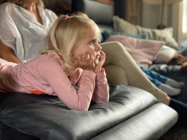 istock Girl watching tv 1253824682