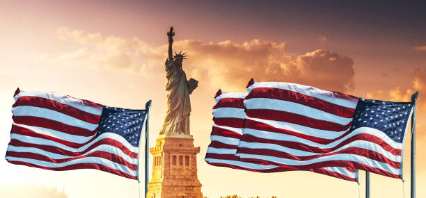 istock us flag on the statue of liberty 1253824845