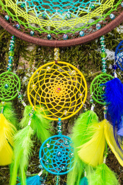 istock Handmade dream catcher with feathers threads and beads rope hanging 1253829841