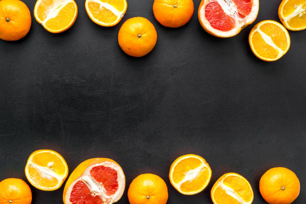 istock Frame of citrus - oranges and frapefruit on kitchen table. Top view, copy space 1253830198