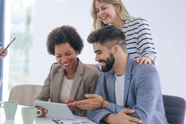 istock Three people working in an office Stock photo 1253831620