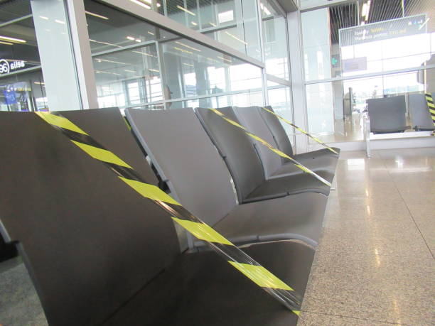 istock Empty chairs in airport due to covid-19 1253831737
