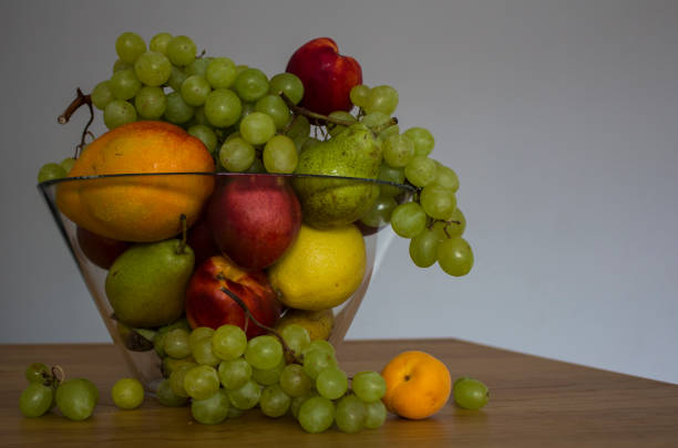 istock Vase with multicoloured fruits 1253833738